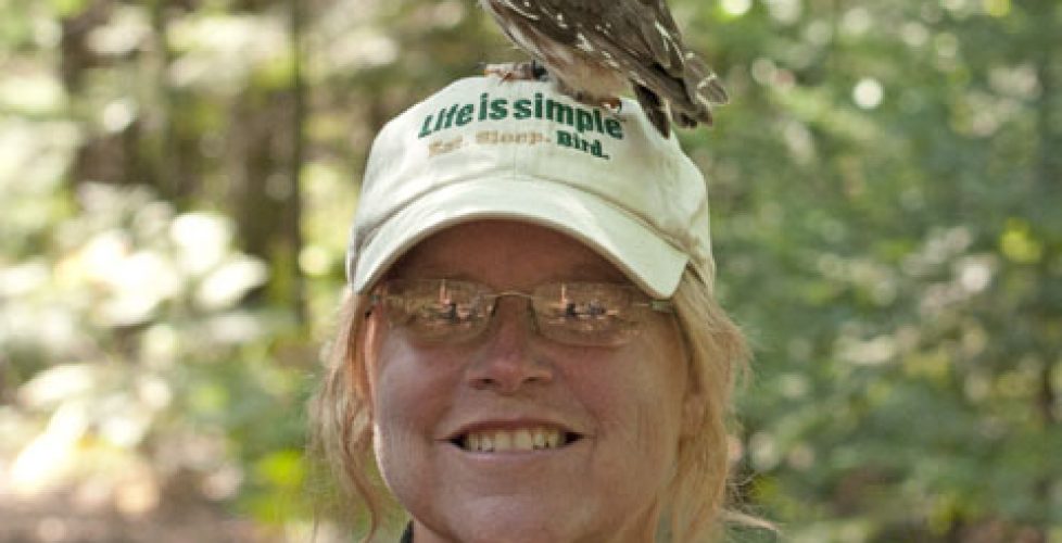 Ann Brokelman with Saw Whet owl on her hat