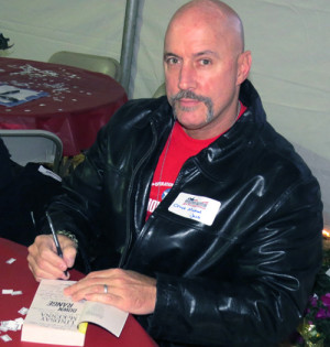 Chief Jaco autographing a copy of Down Range