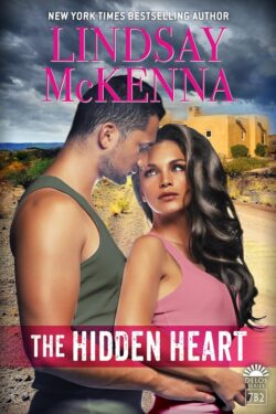 Book cover for The Hidden Heart by Lindsay McKenna featuring dark-haired man in olive tanktop holding dark-haired woman in pink camisole in front of adobe structure and dark thunderclouds in the sky